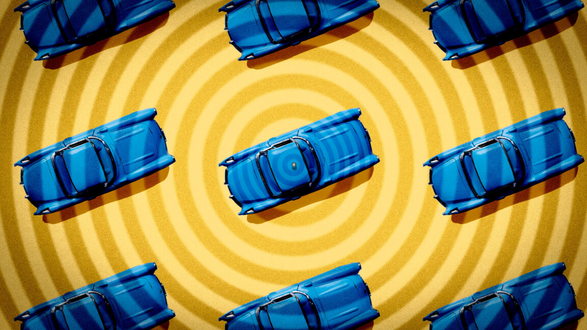 blue cars, seen from above, on a radiating yellow pattern