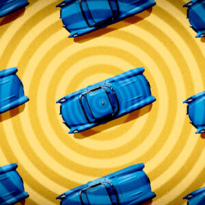blue cars, seen from above, on a radiating yellow pattern