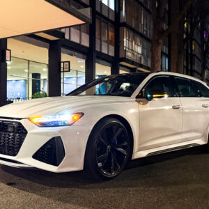A white Audi RS6 Avant at night