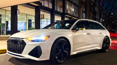 A white Audi RS6 Avant at night