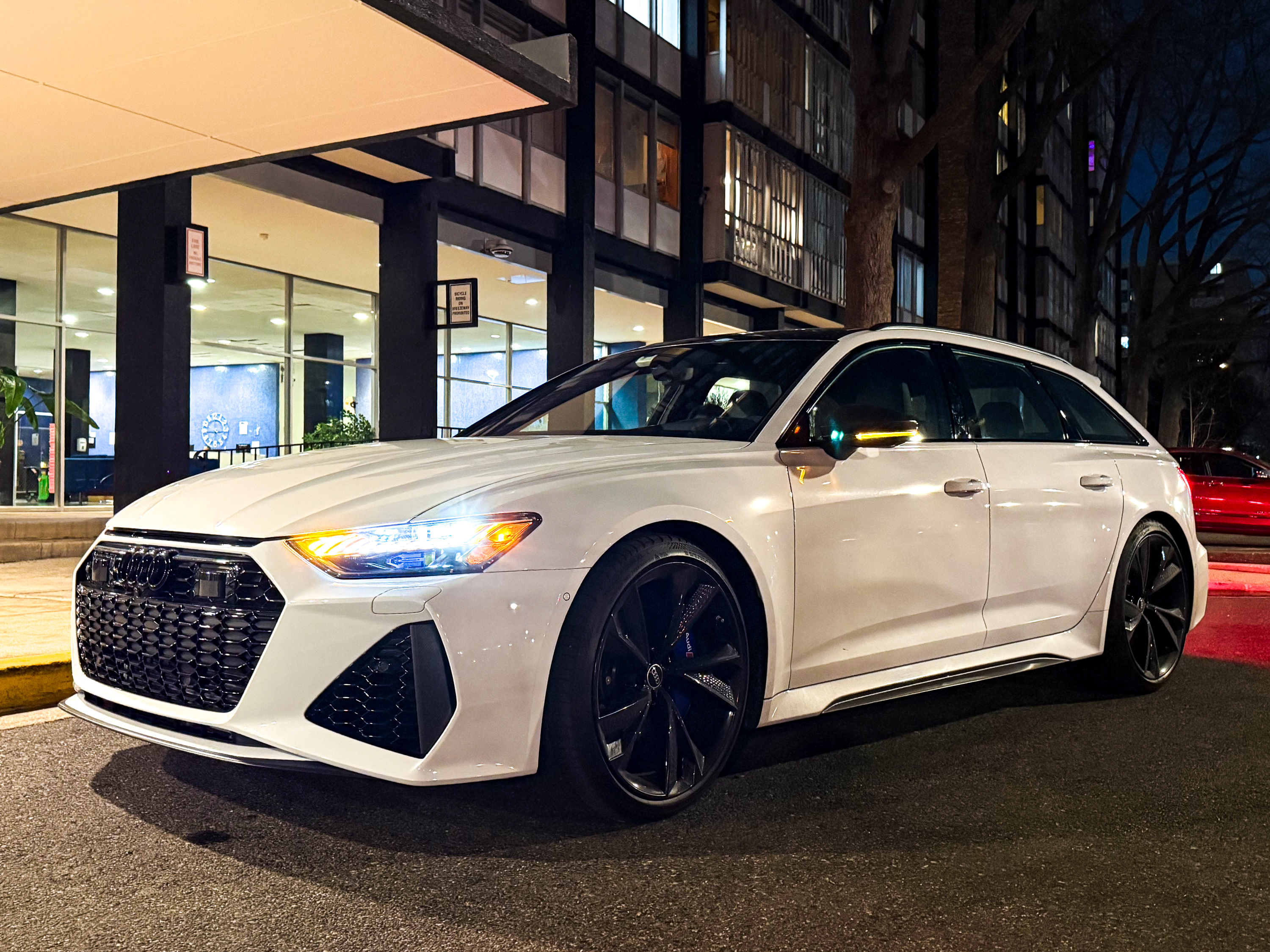 A white Audi RS6 Avant at night