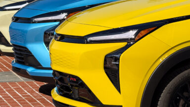A row of Chevrolet Bolt noses in the sun