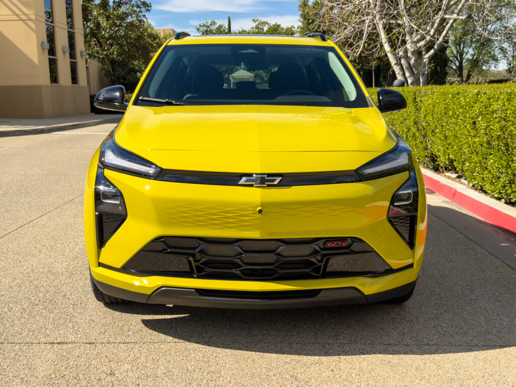 A yellow Chevy bolt, head-on