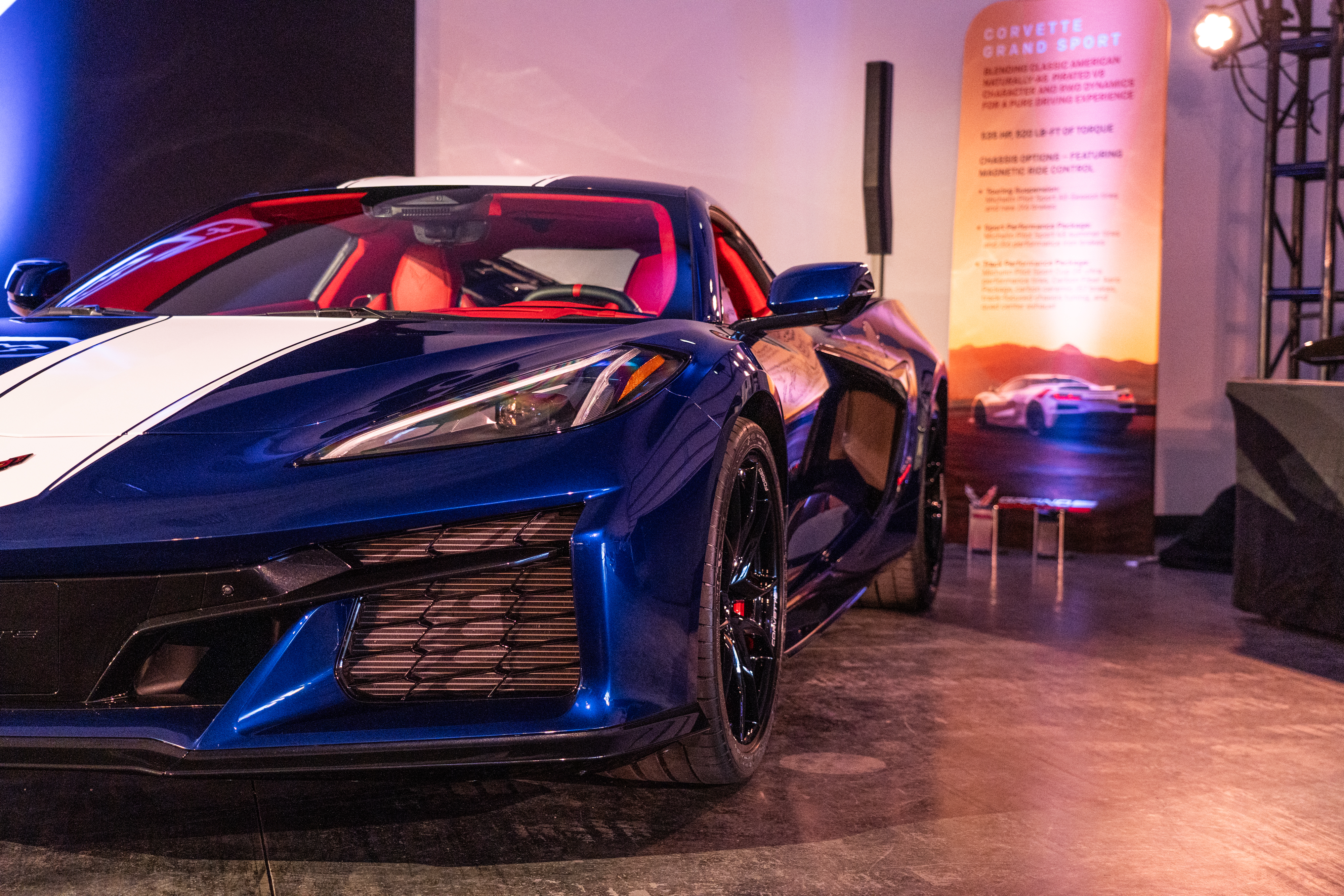 A partial shot of a blue corvette