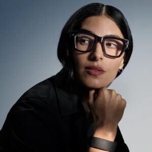 A woman wearing Ray-Ban Meta smart glasses.