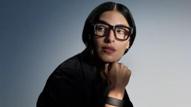 A woman wearing Ray-Ban Meta smart glasses.