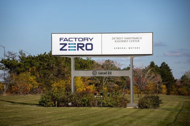 DETROIT, MICHIGAN - OCTOBER 29: A sign for General Motors' Factory Zero plant is seen on October 29, 2025 in Detroit, Michigan. General Motors announced today it will be laying off 3,300 hourly employees around the country at plants that make electric vehicles and batteries due to slowing EV consumer interest. GM's all-electric Factory Zero plant, which manufactures the Chevrolet Silverado EV and the GMC Sierra EV, among others, will be hit the hardest, with 1,200 workers to be laid off. (Photo by Bill Pugliano/Getty Images)