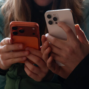 people holding iphones