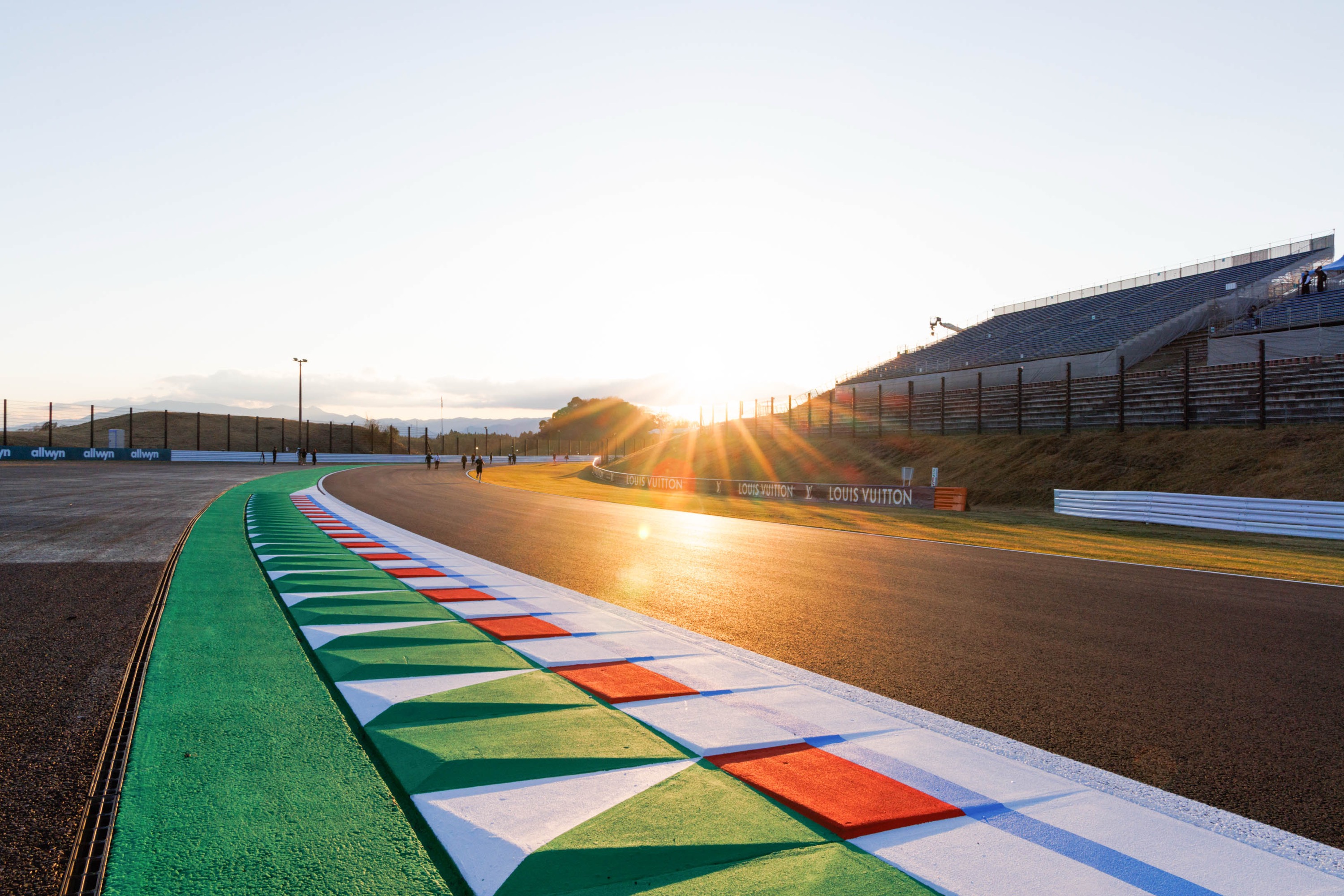 SUZUKA, MIE PREFECTURE, JAPAN - 2026/03/26: The sun sets on the ripple strip at the exit of the 130R corner ahead of the F1 Grand Prix of Japan at the Suzuka Circuit. (Photo by George Hitchens/SOPA Images/LightRocket via Getty Images)