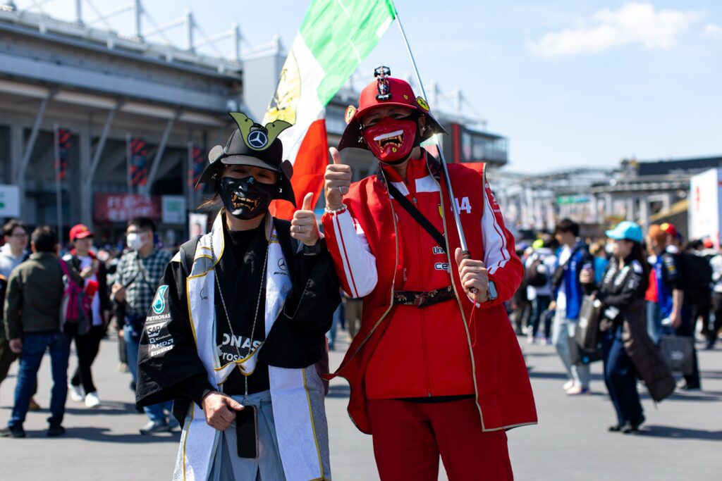 SUZUKA, JAPAN - MARCH 27: Fans pose in the paddock during practice ahead of the F1 Grand Prix of Japan at Suzuka Circuit on March 27, 2026 in Suzuka, Japan. (Photo by Kym Illman/Getty Images)