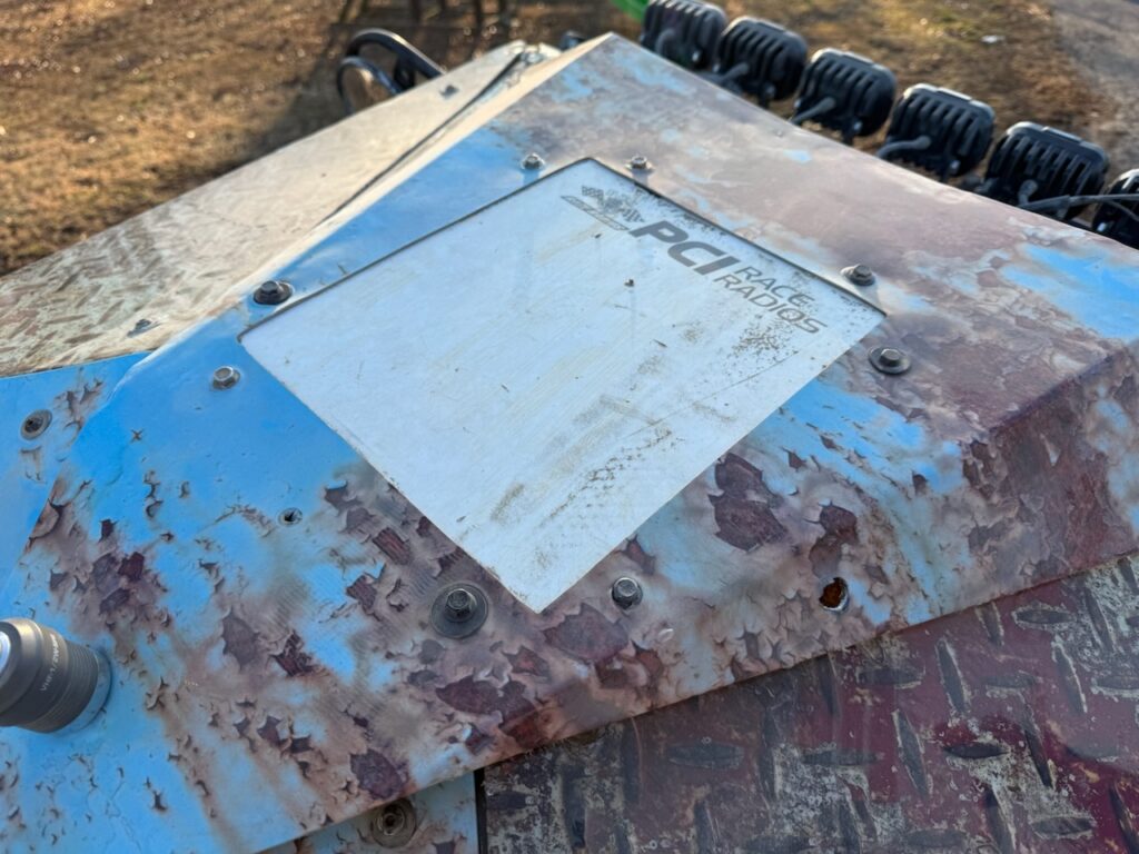 A satellite antenna, mounted into a roof panel of an off-road racer