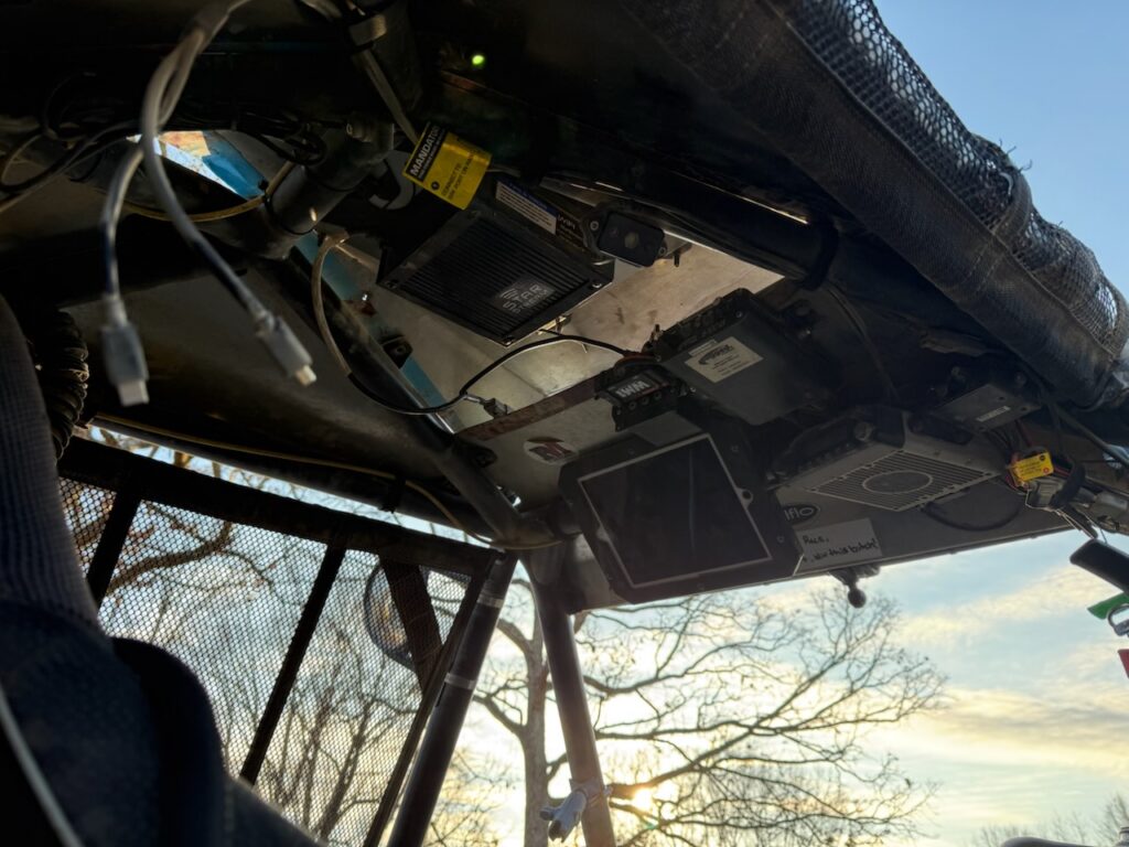 The underside of the roof of an off-road race car, with electronics modules mounted to it