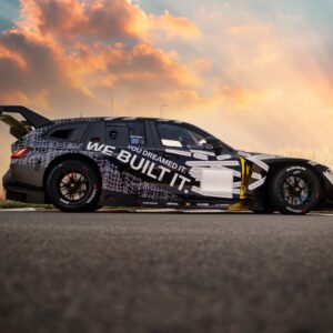 A BMW M3 Touring race car parked at a track