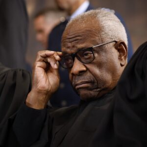Supreme Court Justice Samuel Alito and Clarence Thomas wear their traditional robes at a presidential inauguration ceremony.