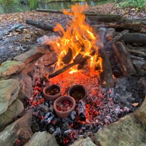 Experimental cooking over an open fire with modern replica pottery vessels to recreate prehistoric recipes