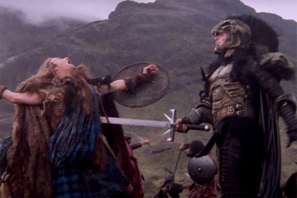 scots highlander in kilt being stabbed on the battlefield by a brutish knight in black