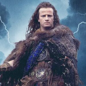 shot of a powerfully built man in a fur cape and kilt standing against a thunderous sky as lightning strikes