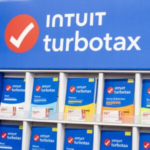 A large display inside a store holds numerous versions of the Intuit TurboTax tax-preparation software.