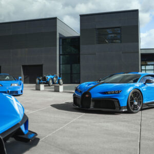 A Bugatti Chiron, EB110, Type-35, and the corner of another one are parked together.