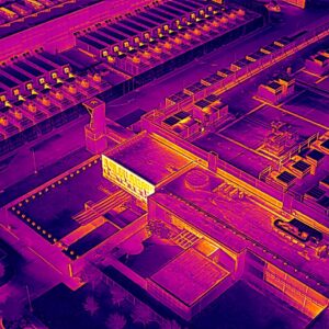 A data center in Garland, Texas as seen through a drone's thermal imaging camera that primarily displays purple, orange, red and yellow colors to show heat signature.