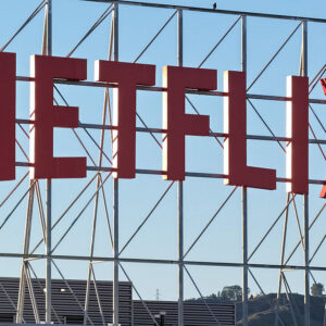 In an aerial view, the Netflix logo is displayed above Netflix corporate offices.