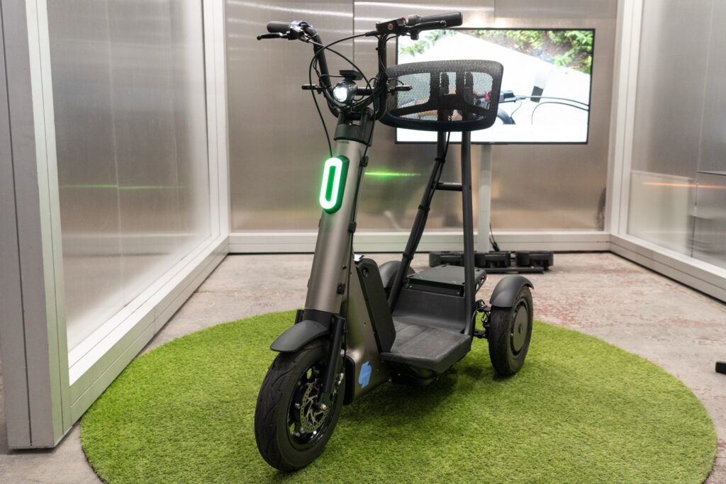 A three-wheeled mobility scooter.