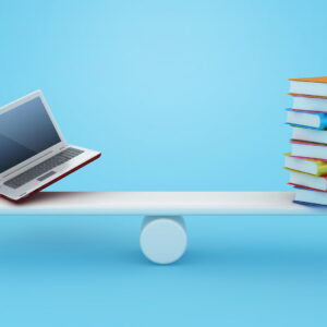 Books balanced on a see saw with a laptop