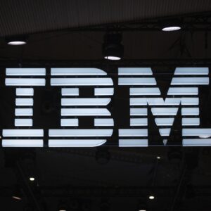 A large IBM logo at a conference exhibition.