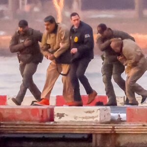 Ousted Venezuelan President Nicolas Maduro being escorted by US law enforcement officials.