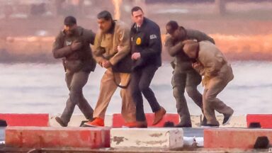 Ousted Venezuelan President Nicolas Maduro being escorted by US law enforcement officials.