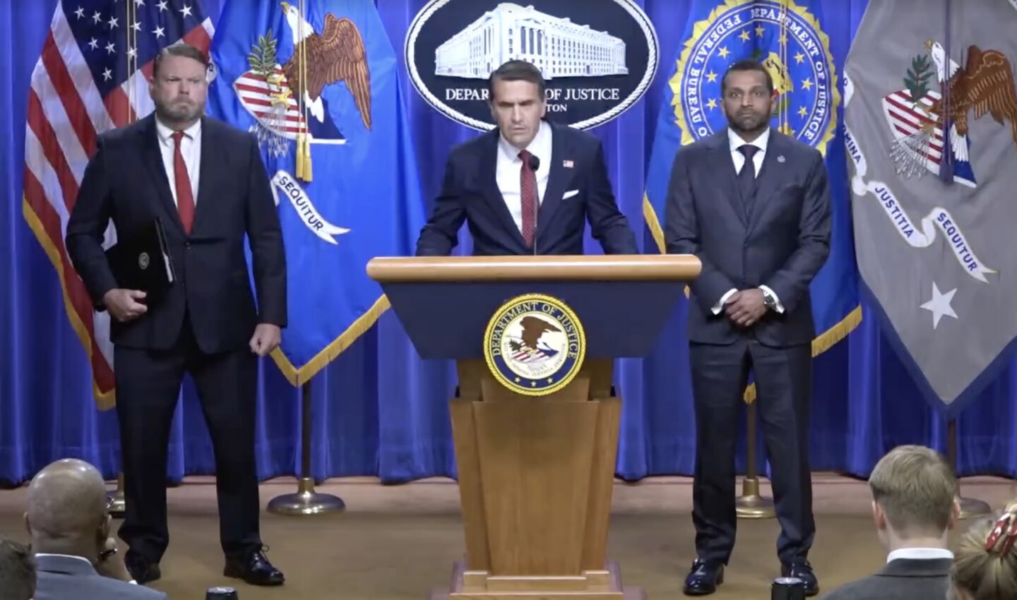 A photo of the DOJ press conference about the indictment.