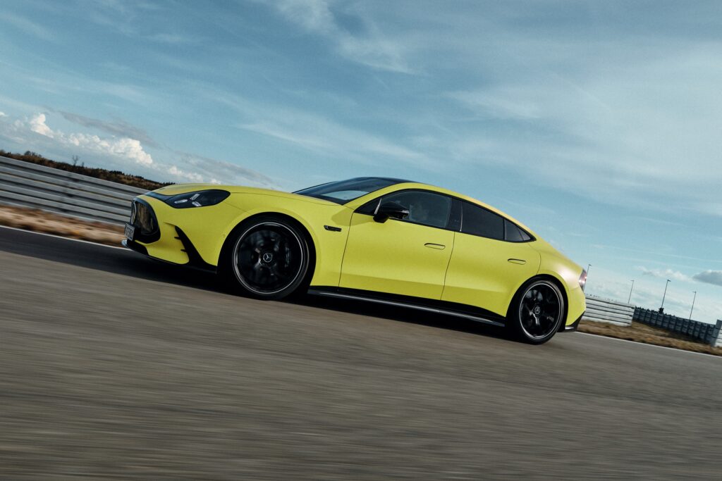 A yellow Mercedes-AMG GT 63 4-Door Coupe on track