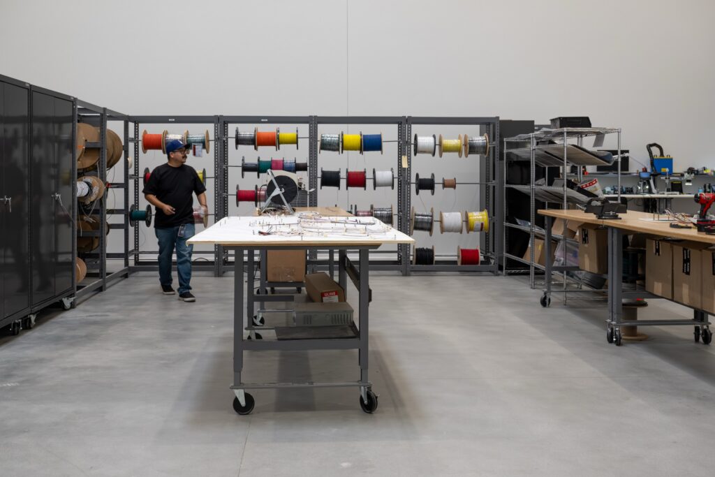 A man standing in a workshop.