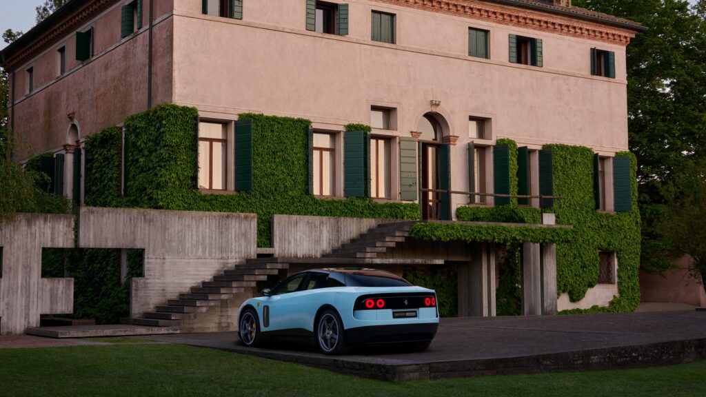 A blue Ferrari Luce seen from behind.