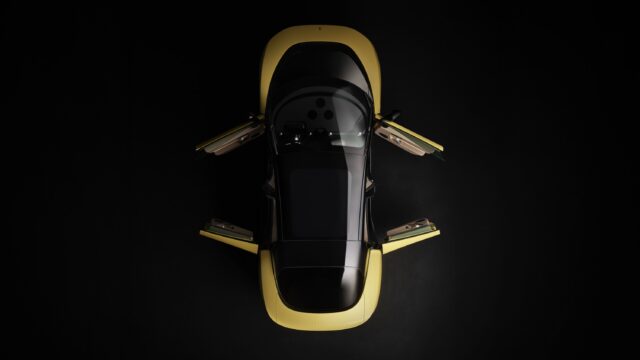 A yellow Ferrari Luce seen from the top down, with its doors open.