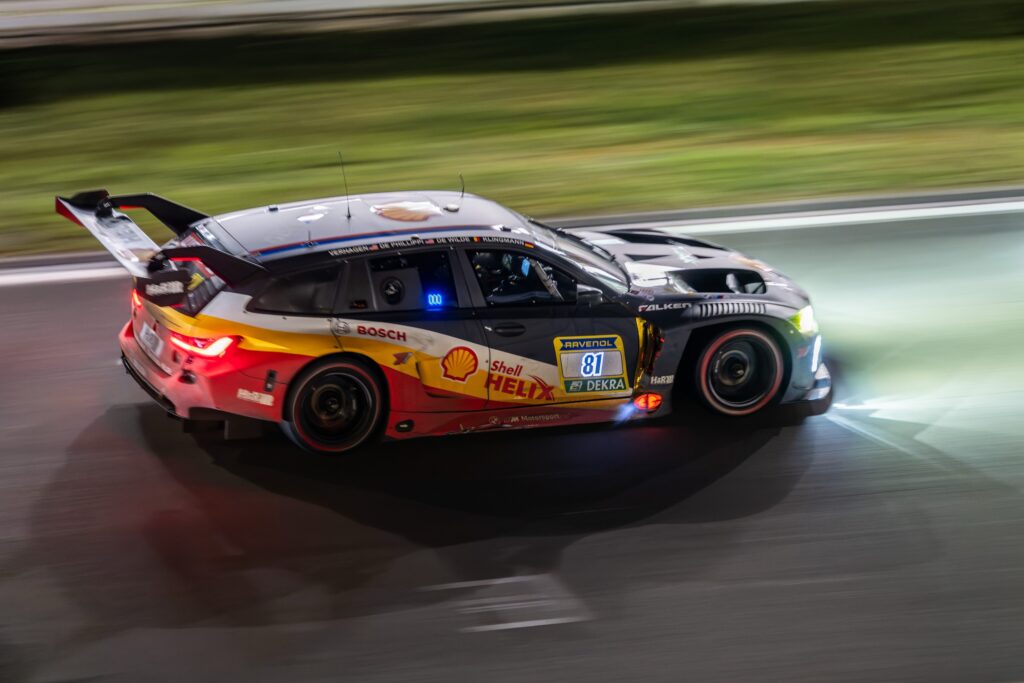 17 May 2026, Rhineland-Palatinate, Nürburg: The BMW M3 Touring 24h with starting number 81 from the BMW M Motorsport team with drivers Jens Klingmann, Ugo de Wilde, Connor de Phillippi and Neil Verhagen will race at night on the Nürburgring Grand Prix circuit during the 24h race. Photo: Silas Stein/dpa (Photo by Silas Stein/picture alliance via Getty Images)
