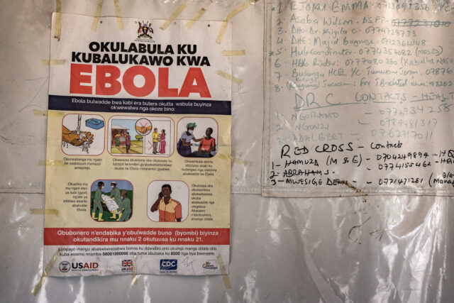 Healthcare workers in protective equipment treating Ebola patients