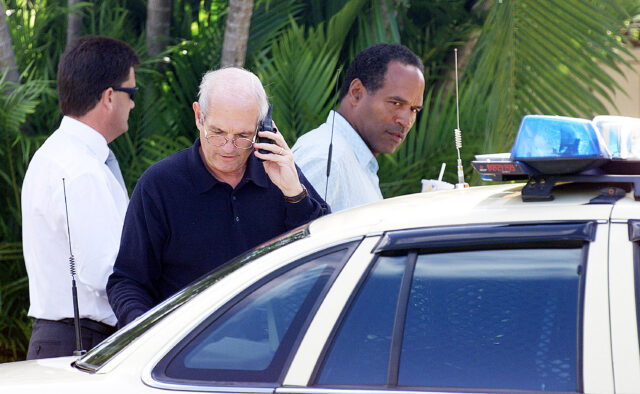photo of O.J. Simpson on December 4, 2001, while his home was being searched.