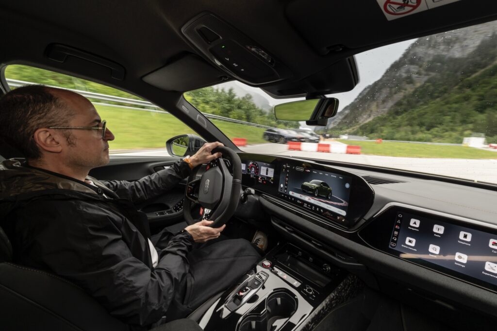 A man drives an Audi RS5 on track
