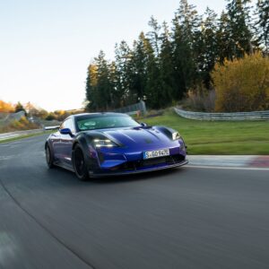 A purple porsche taycan at the nurburgring