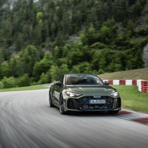 A green Audi RS5 on track