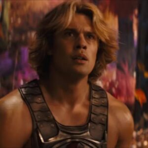 very muscular young man with wave blond hair in a He-Man costume.