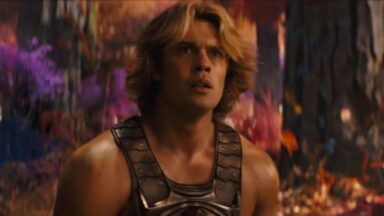 very muscular young man with wave blond hair in a He-Man costume.