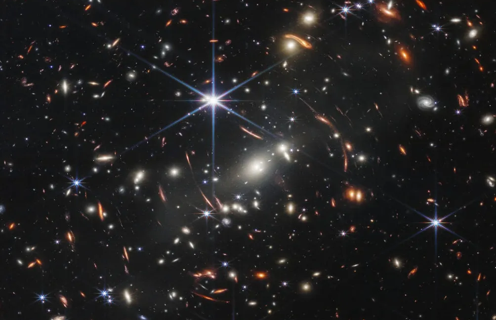 Gravitational lens shows a galaxy just 800 million years post-Big Bang