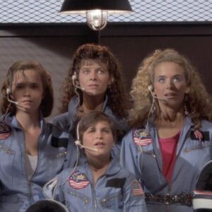 Still from SpaceCamp showing the cast about to board the shuttle