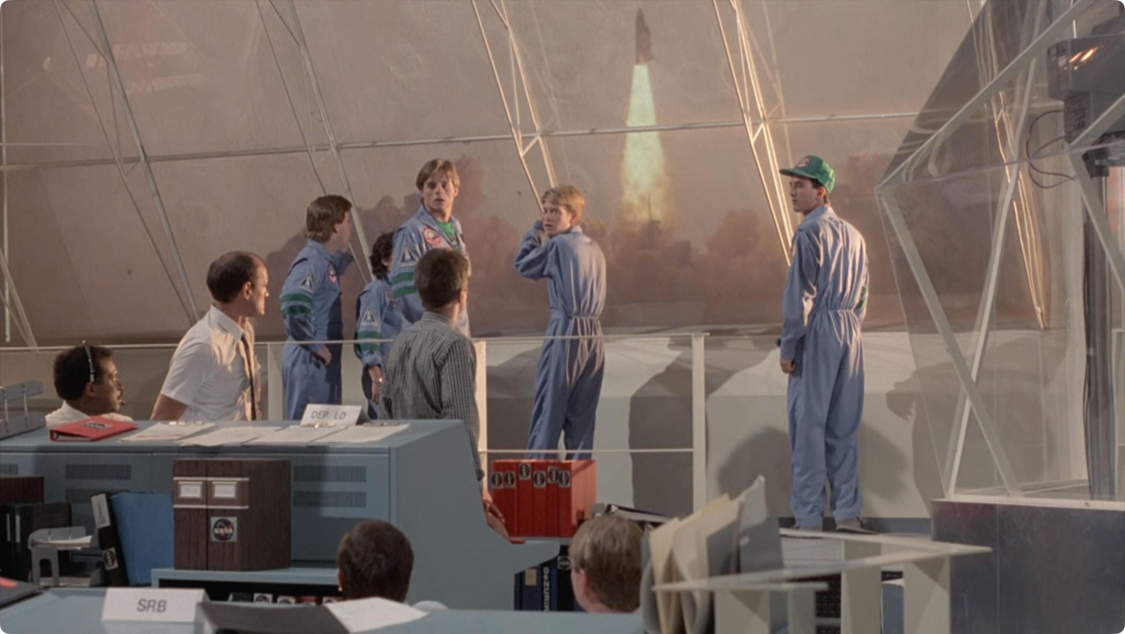 Still from SpaceCamp showing the shuttle Atlantis unexpectedly launching