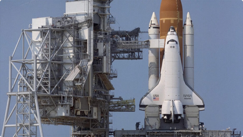 Still from SpaceCamp showing Atlantis about to undergo FRF test