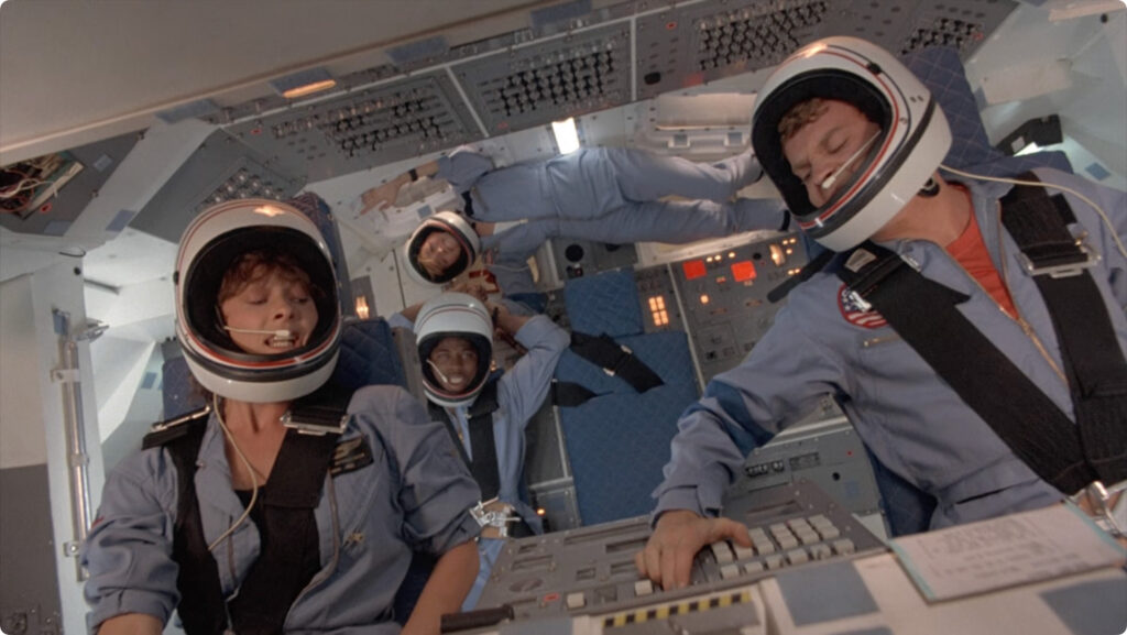 Still from SpaceCamp showing Kevin jettisoning the SRBs