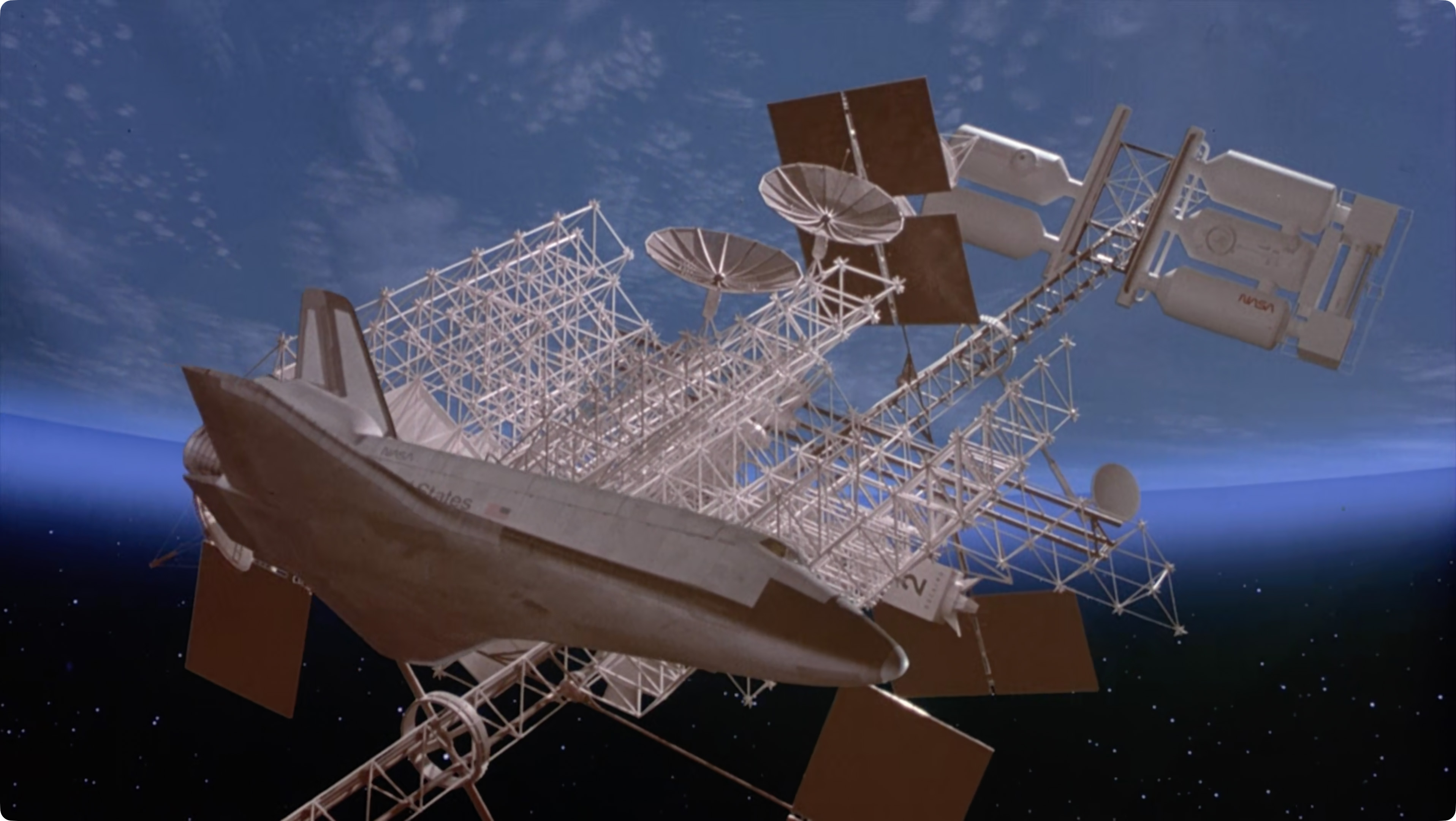 Still from SpaceCamp showing Atlantis approaching Daedalus station