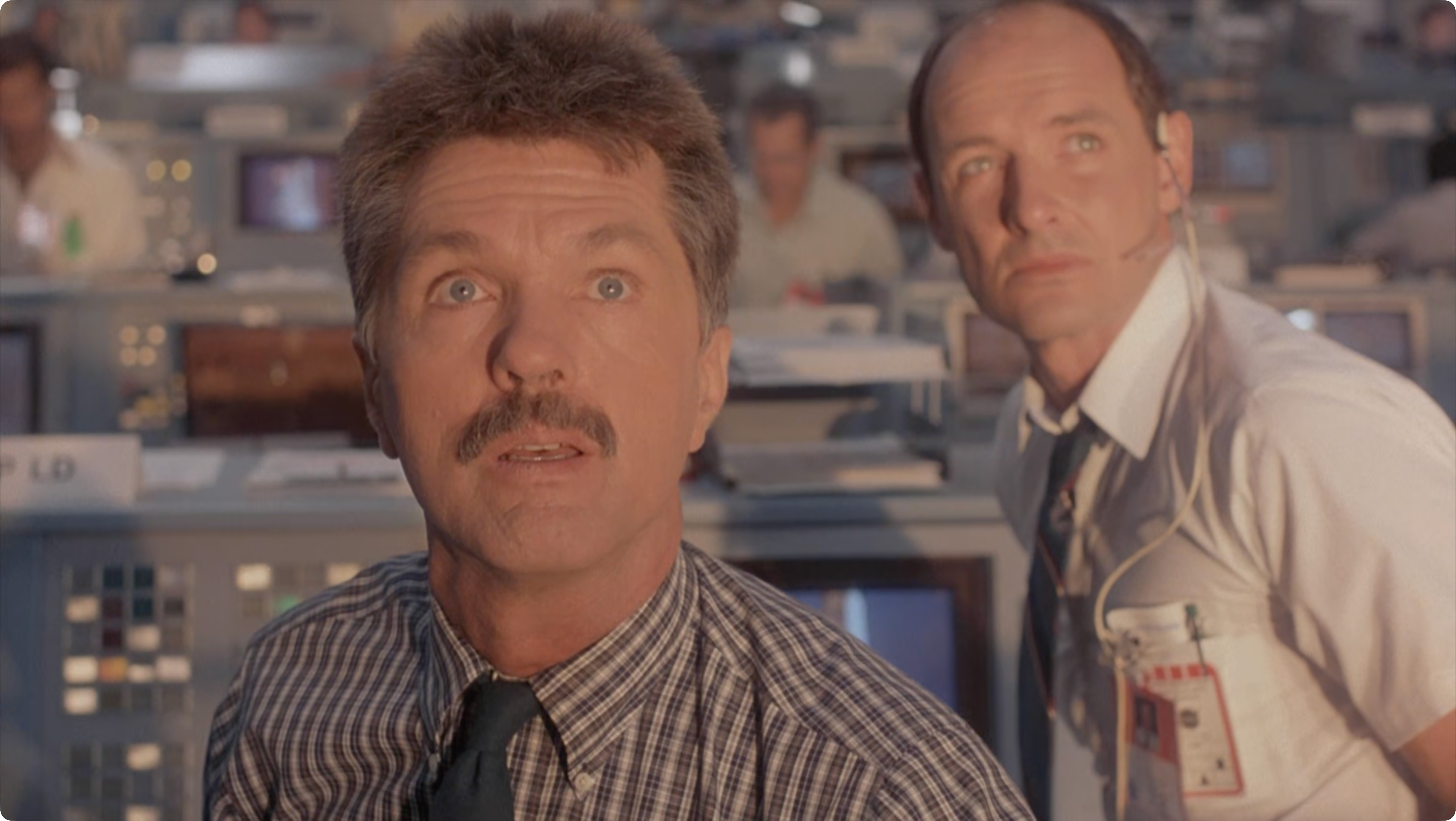 Still from SpaceCamp showing Tom Skerrit's character staring at the shuttle launching